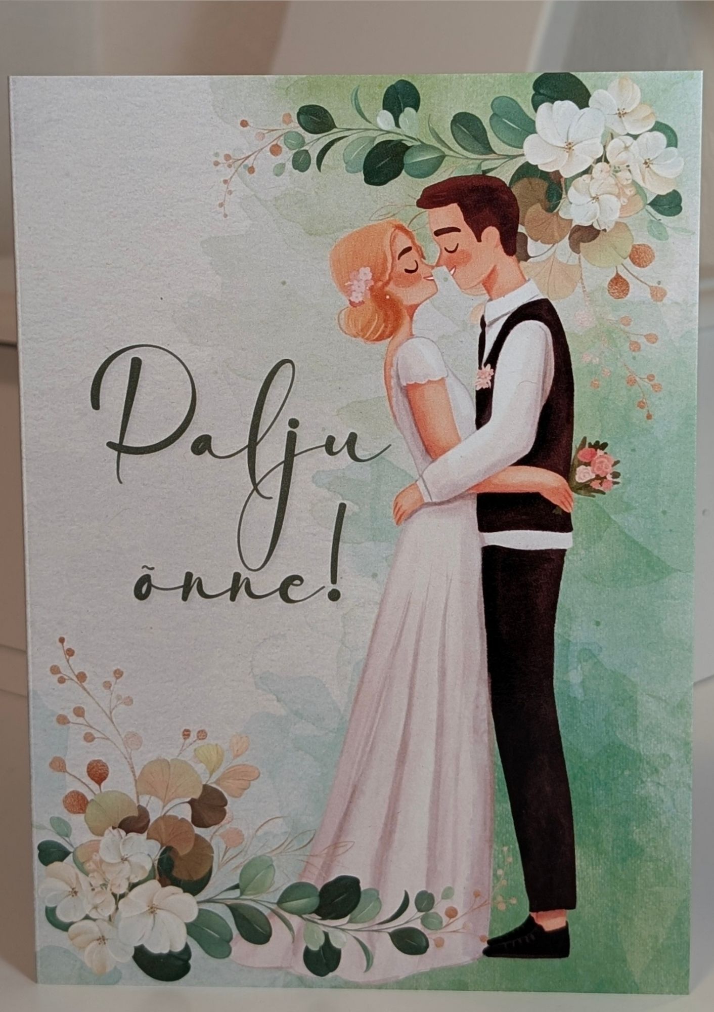 Kutsekunsti elegantne õnnitluskaart pulmadeks lõbusa pruutpaari joonistusega